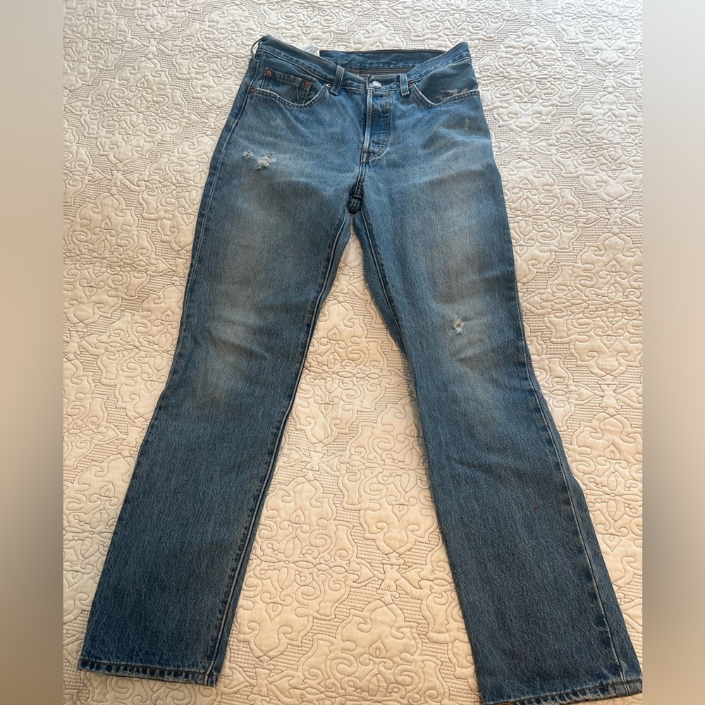 Levi’s 501 distressed jeans size 27x28. In good used condition.